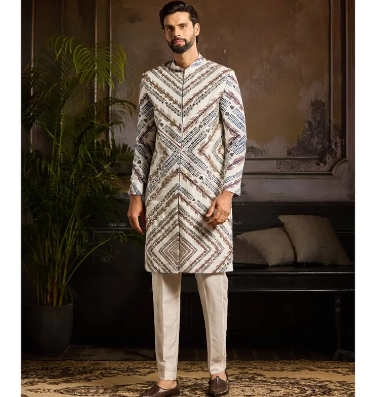 White Chevron Print & Gold Highligted Jacket Paired With White Pants